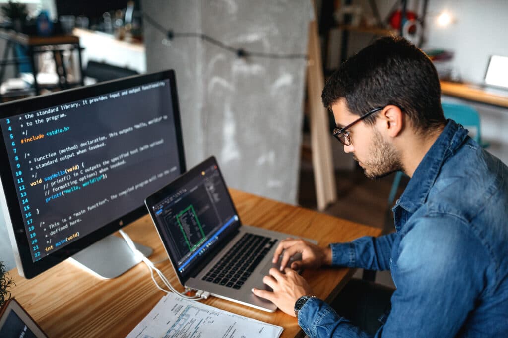 Custom web solutions - laptop with code